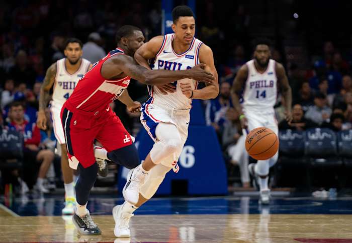 Philadelphia 76ers guard Zhaire Smith (8) is fouled as he attempts to dribbles past Washington Wizards Jalen Jones during the fourth quarter at Wells Fargo Center.